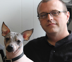 Todd and his dog Gobbo at home in Lansing